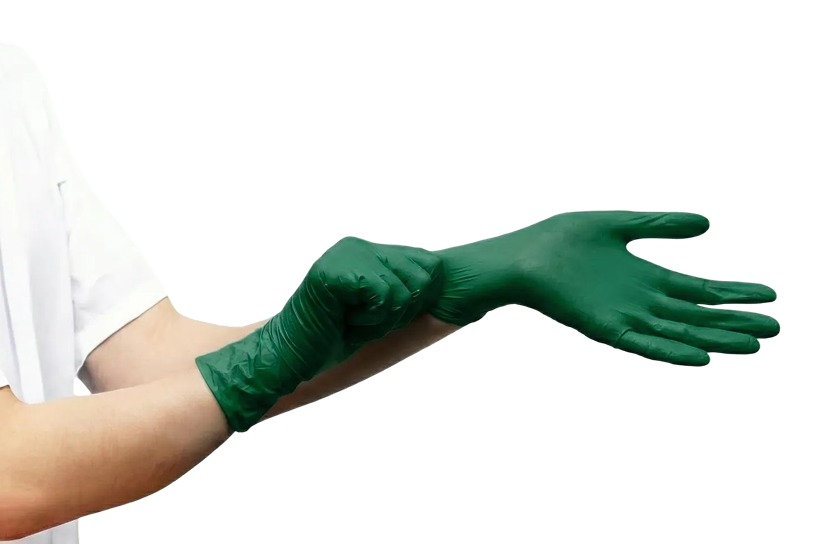 Doctor putting on green medical glove